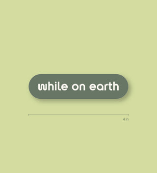 while on earth™ sticker