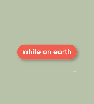 while on earth™ sticker