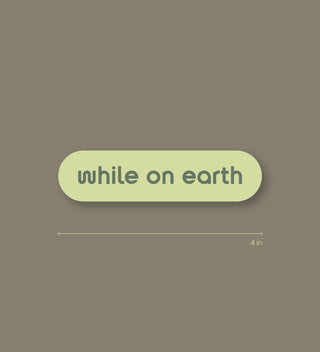 while on earth™ sticker